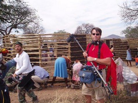 Filming mud hut construction in Africa